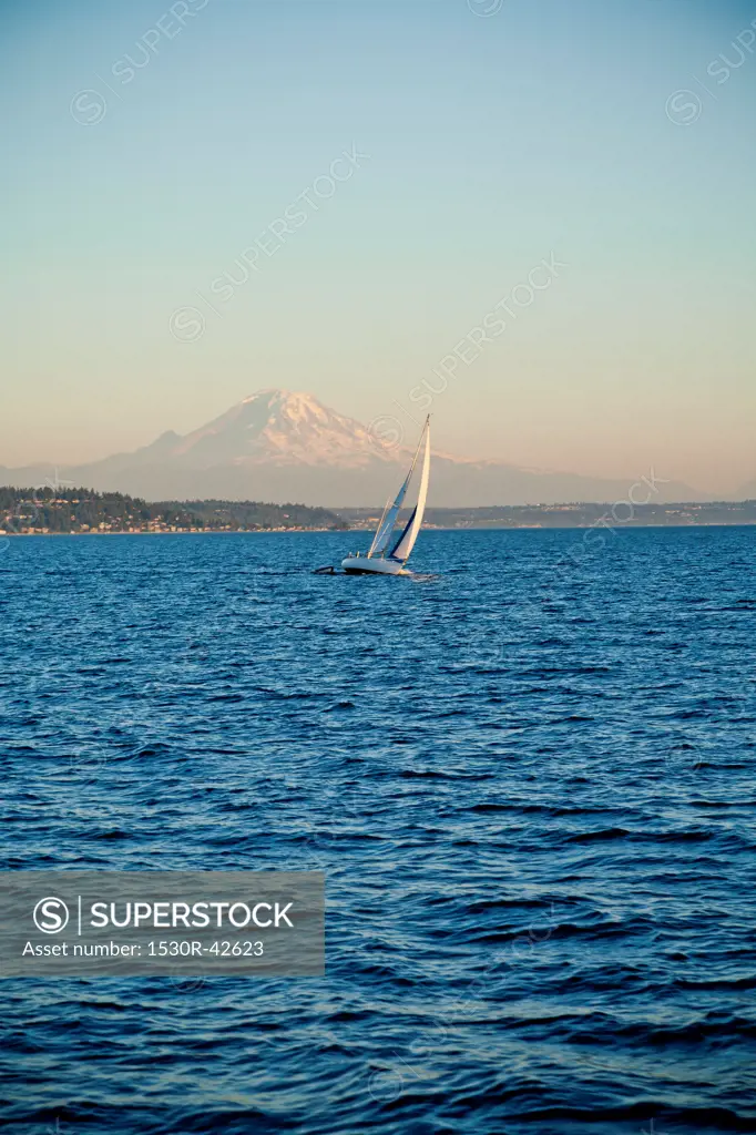 Mt. Rainier behind sail boat on Puget Sound