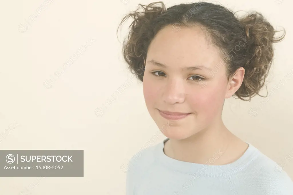 Studio portrait of a teenage girl.