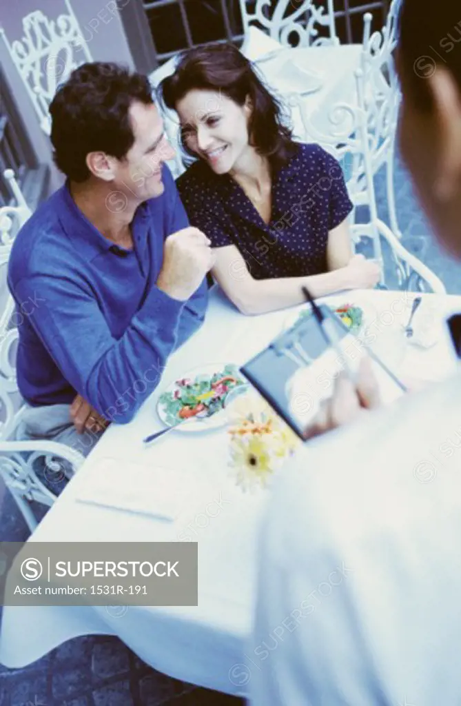 Young couple sitting together at a restaurant