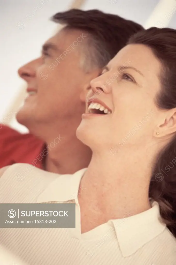Side profile of a mid adult couple smiling