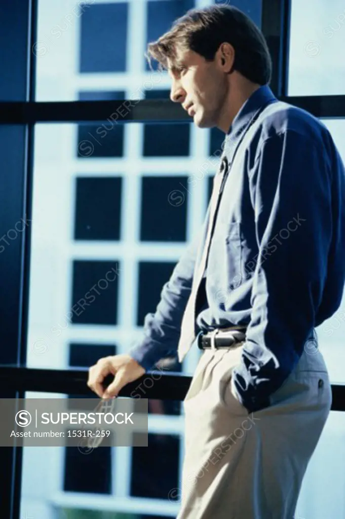 Businessman looking through a window