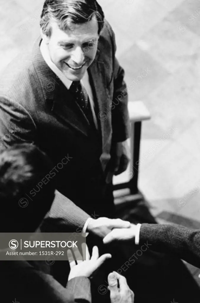 High angle view of a businessman shaking hands