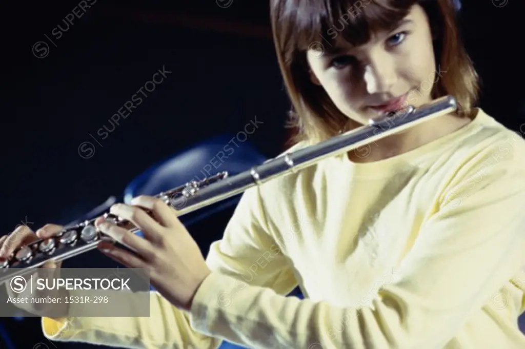 Portrait of a girl playing a flute