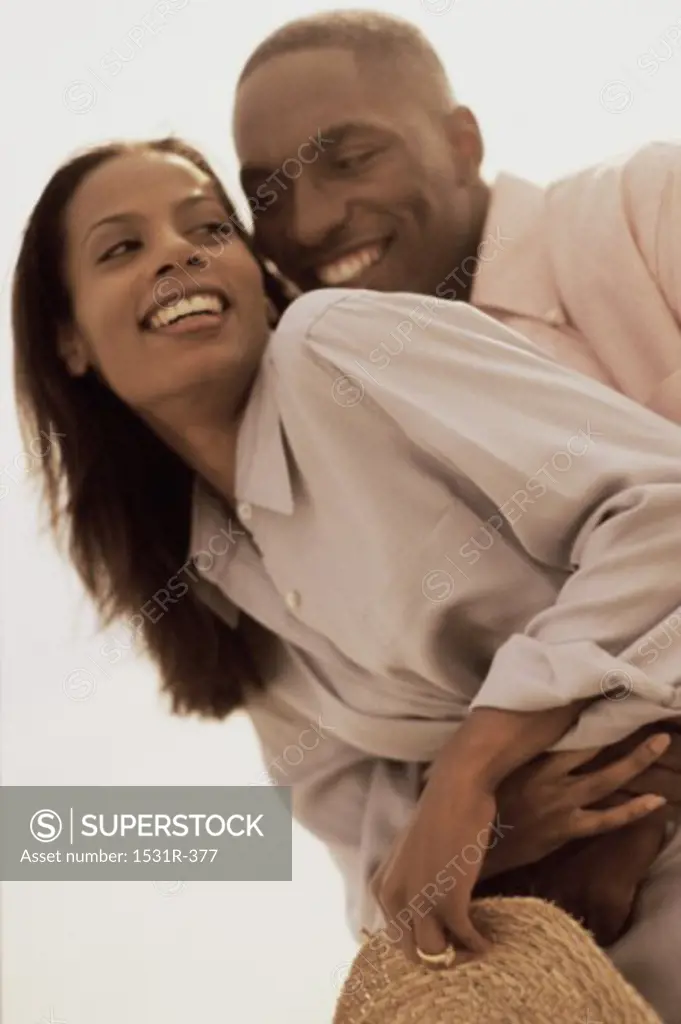 Low angle view of a young couple hugging