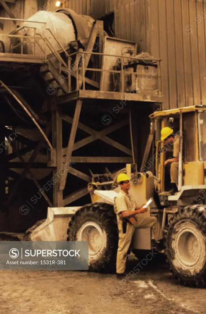 Person standing near a bulldozer