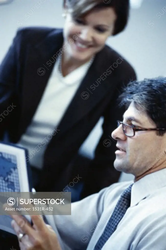 Businessman and a businesswoman in an office