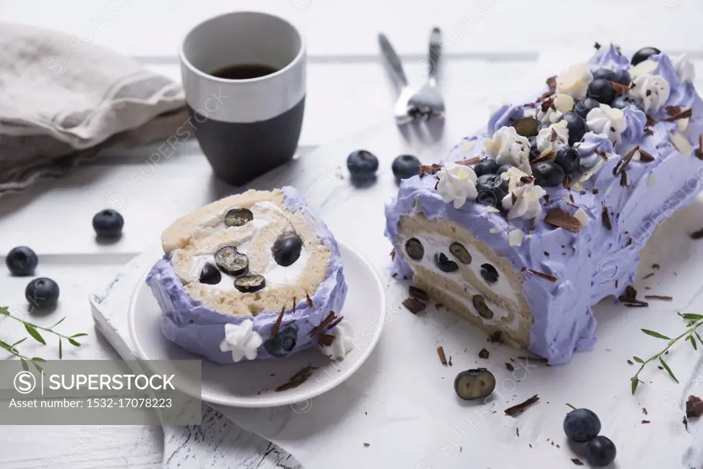 Vegan blueberry Swiss roll with chocolate and almonds