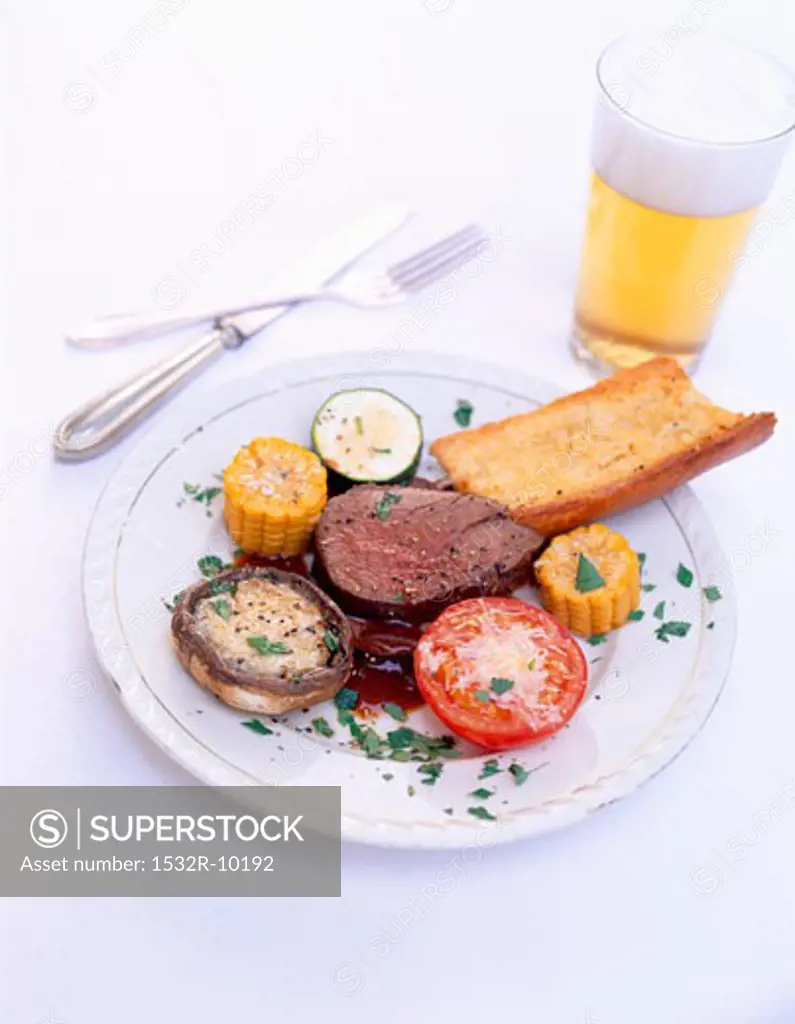 Beef fillet with grilled vegetables and baguette