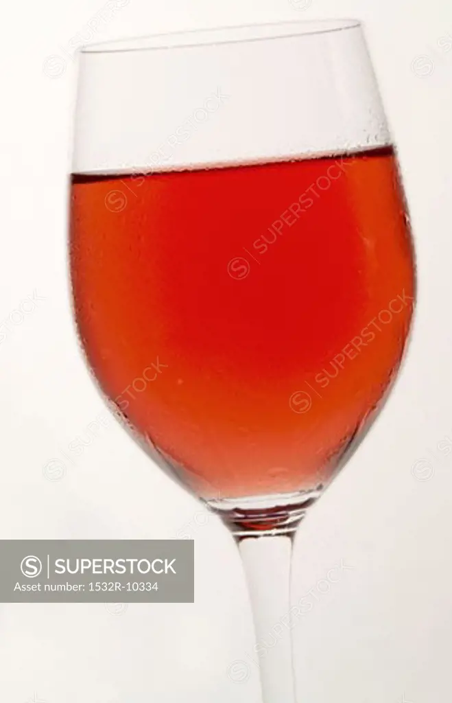 A glass of rosT wine with condensation
