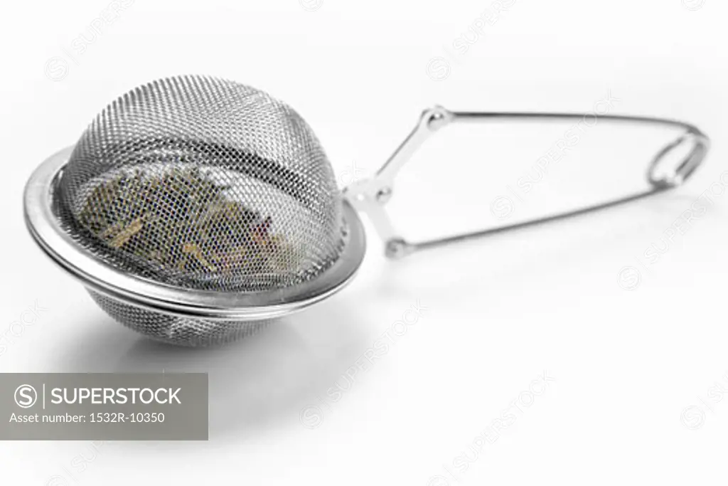 A tea strainer full of tea