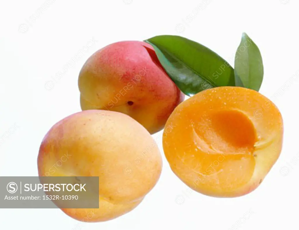 One half and two whole peaches