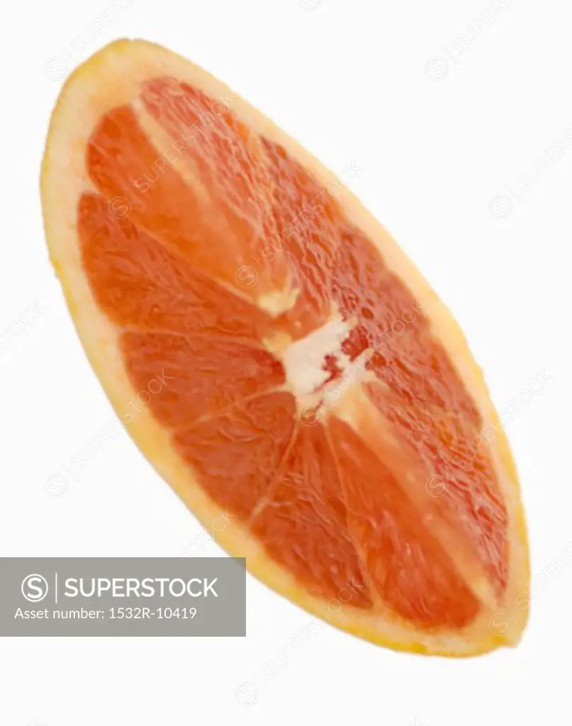 A wedge of red grapefruit