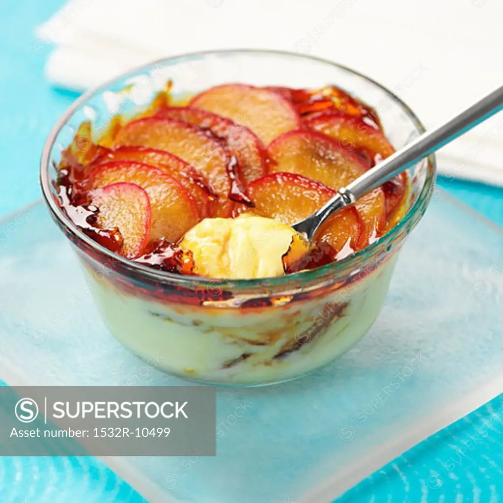 Cream dessert topped with plums