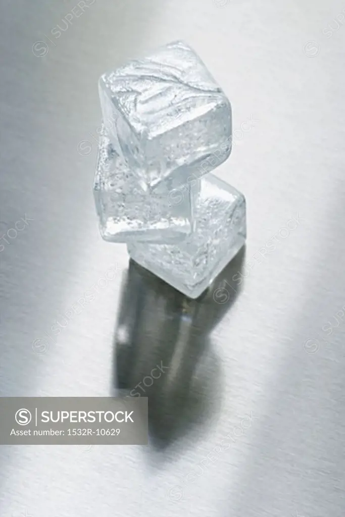 Three ice cubes in a pile