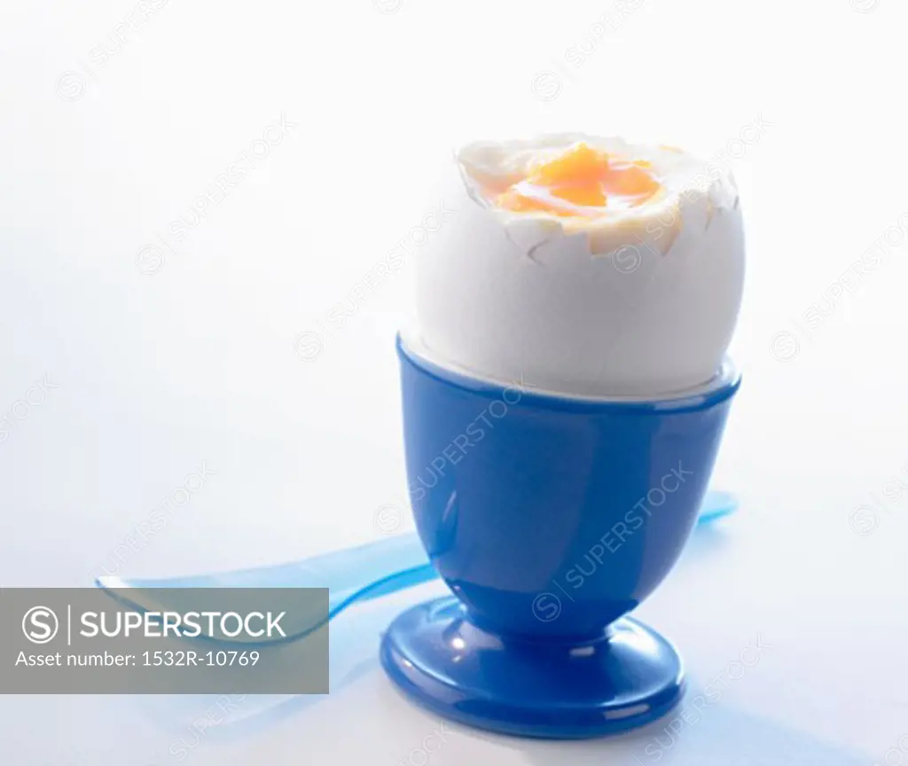 A breakfast egg in a blue eggcup