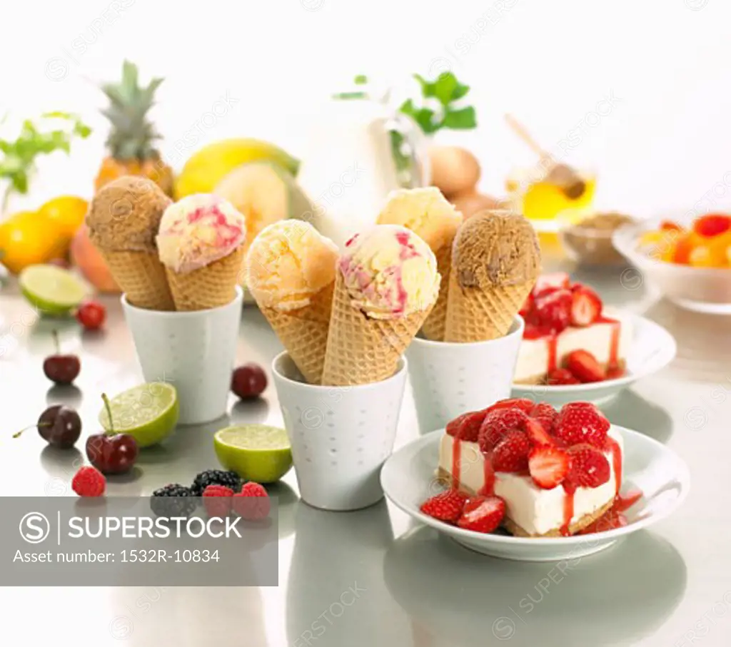 Various types of ice cream, waffle cones and summer fruit