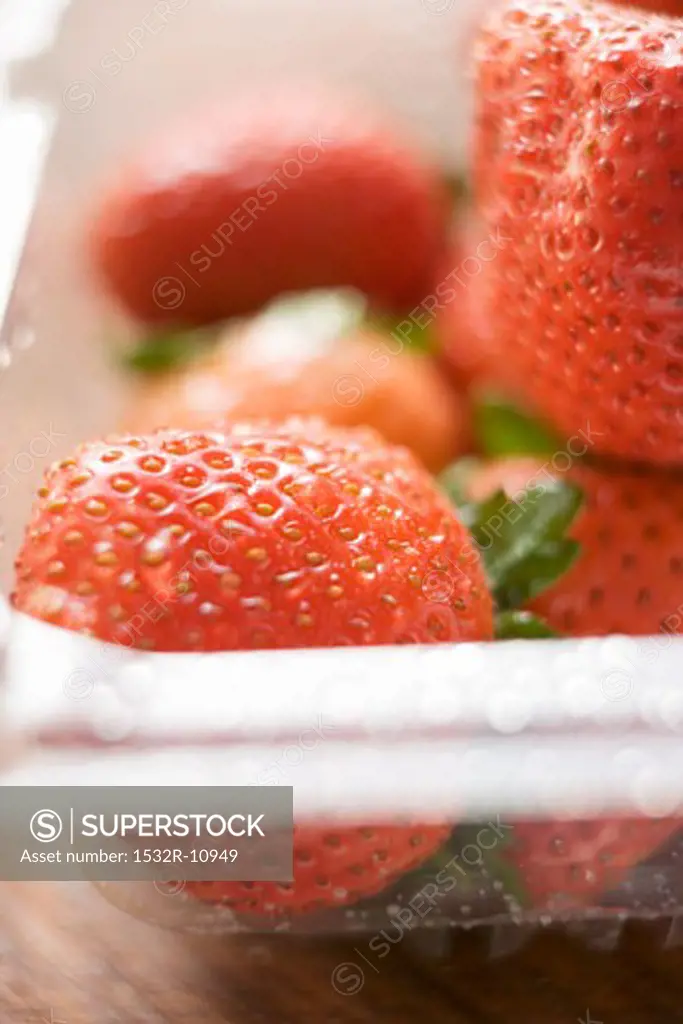 Strawberries in plastic container