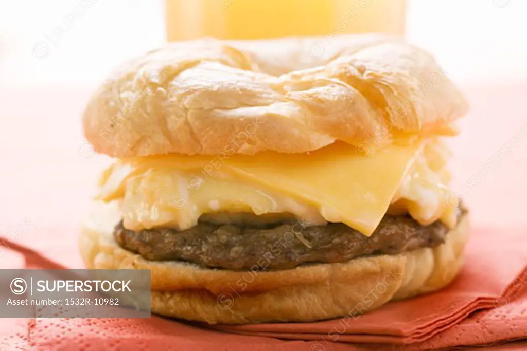 Cheeseburger with scrambled egg on napkin