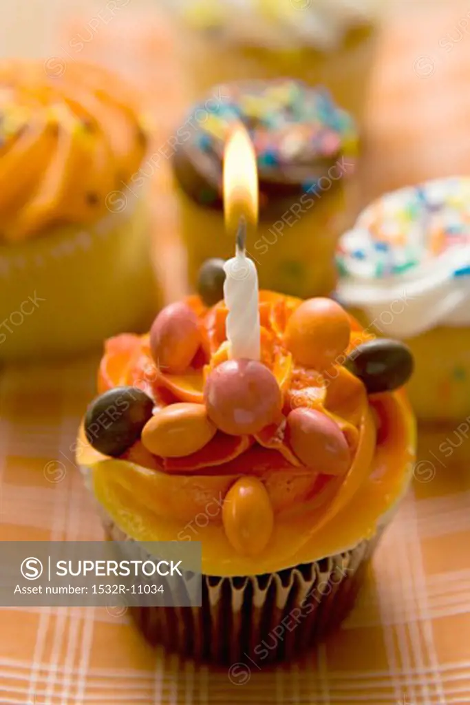 Small cake with a birthday candle