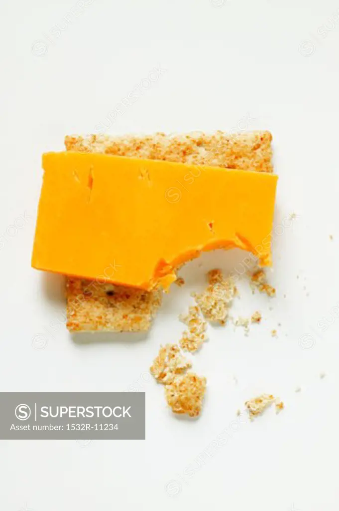 Cracker with Cheddar, a bite taken