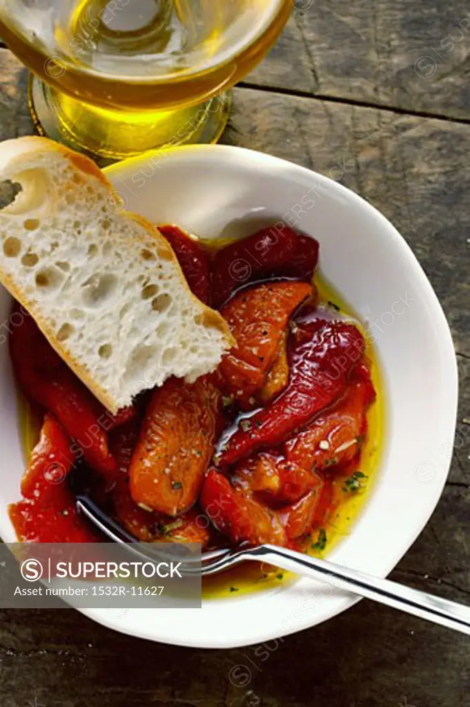 Marinated red peppers with olive oil and white bread