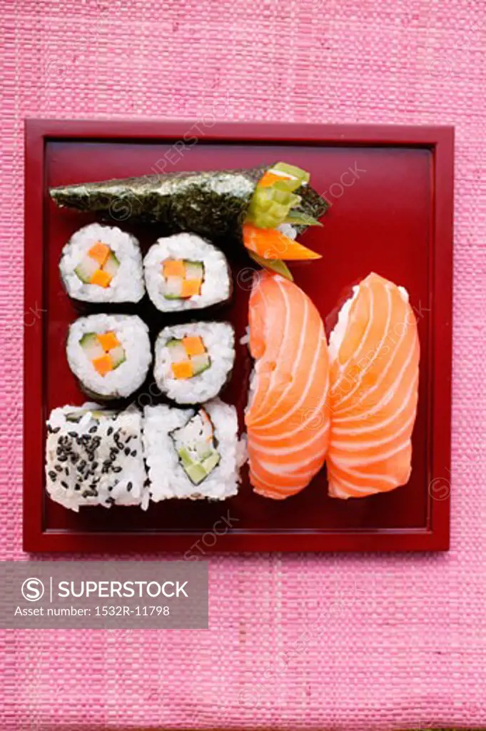 Assorted sushi on red platter