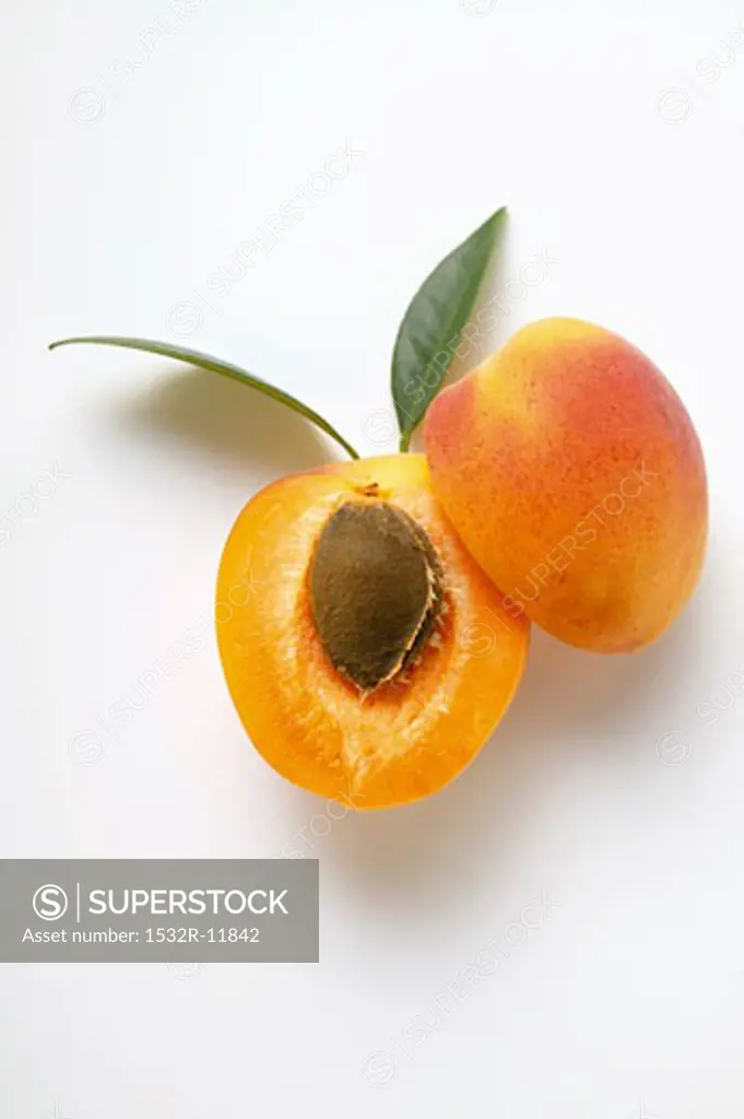 Apricot, halved, with leaves