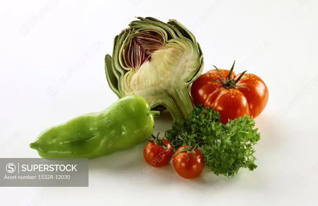Vegetable still life with artichoke, tomatoes and peppers