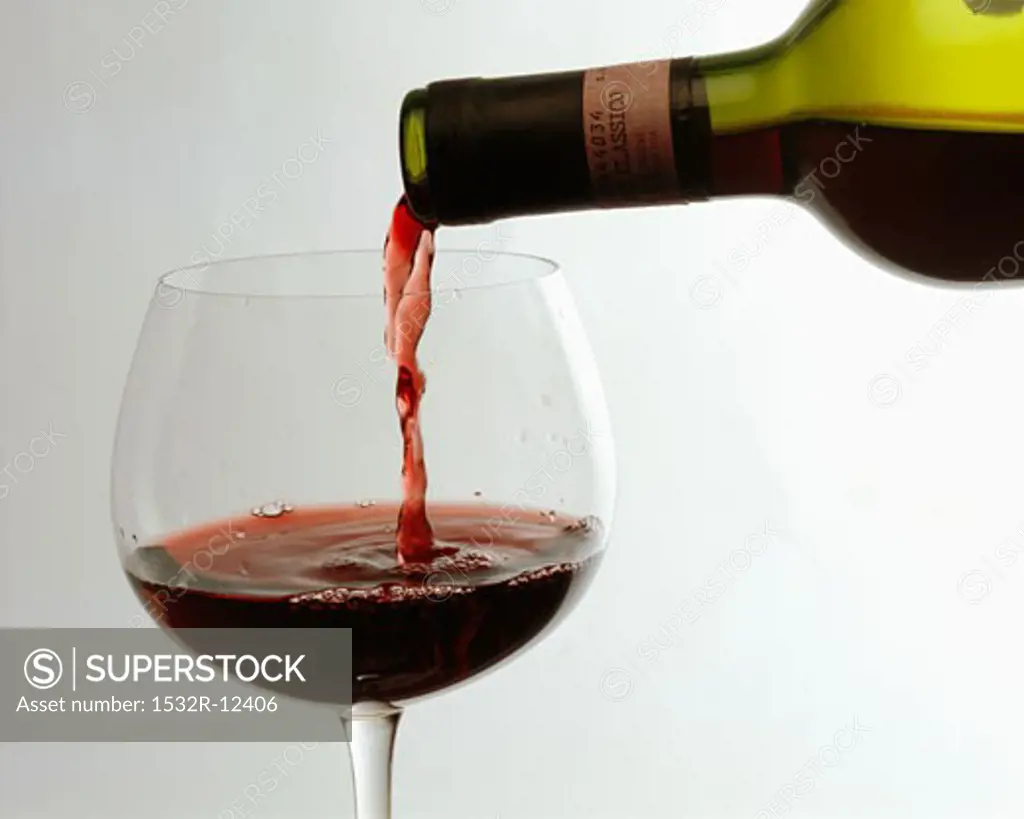 Pouring Chianti Classico into a red wine glass