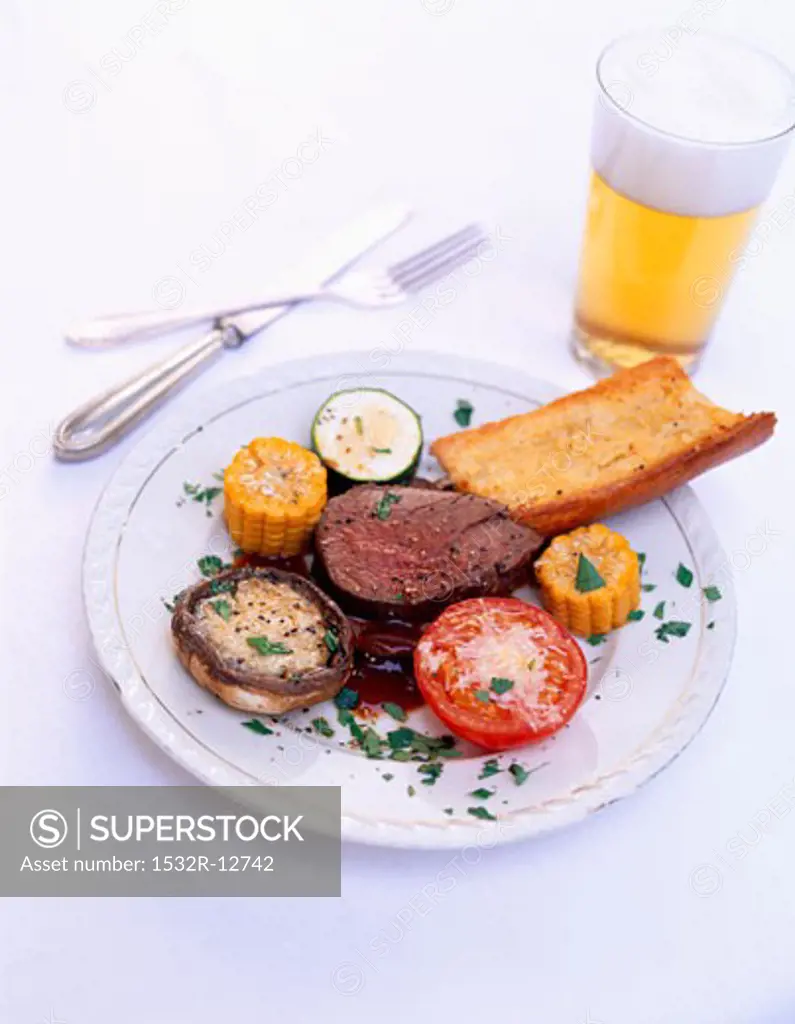 Beef fillet with grilled vegetables and baguette