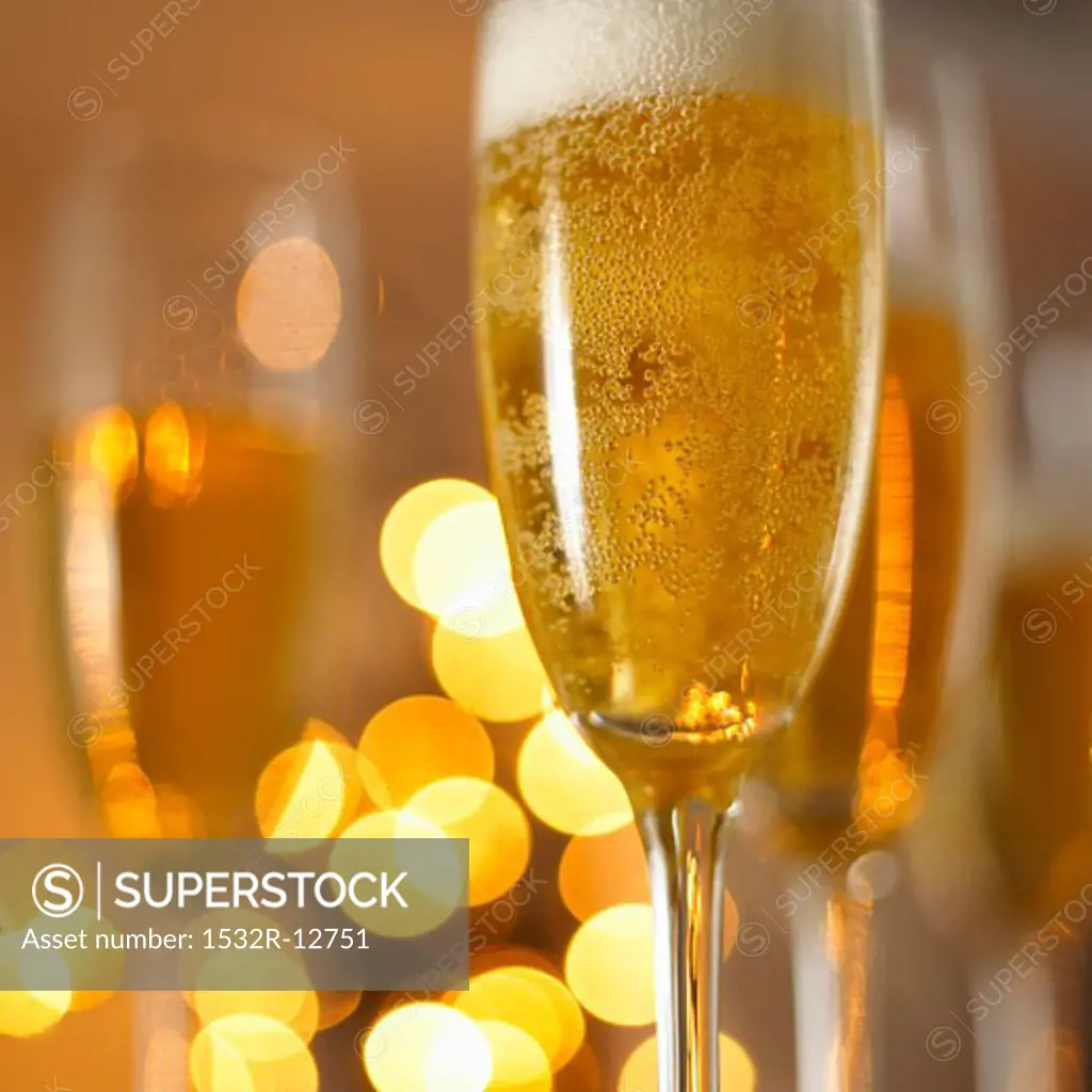 A glass of champagne in festive light
