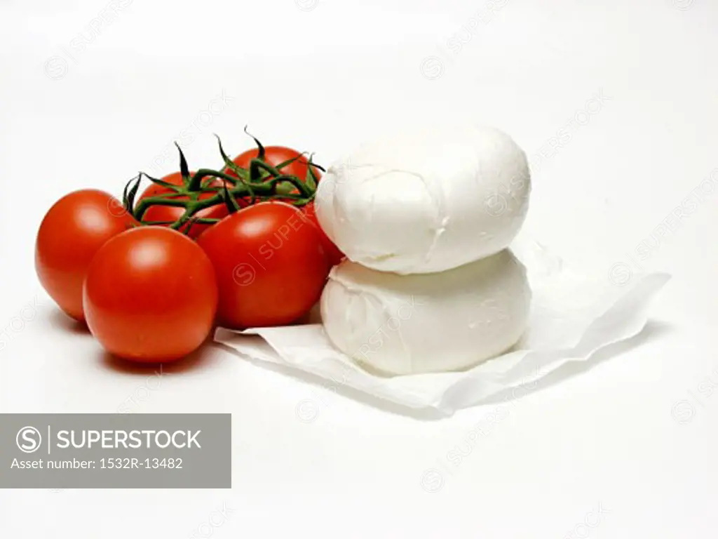 Two Balls of Mozzarella with Several Vine Ripened Tomatoes