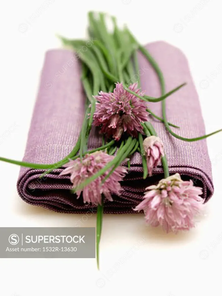 Flowering Chives Resting on a Lilac Napkin