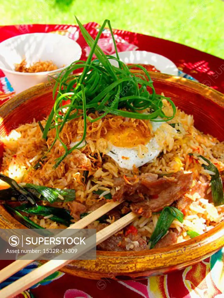 Nasi goreng with fried egg and spring onions