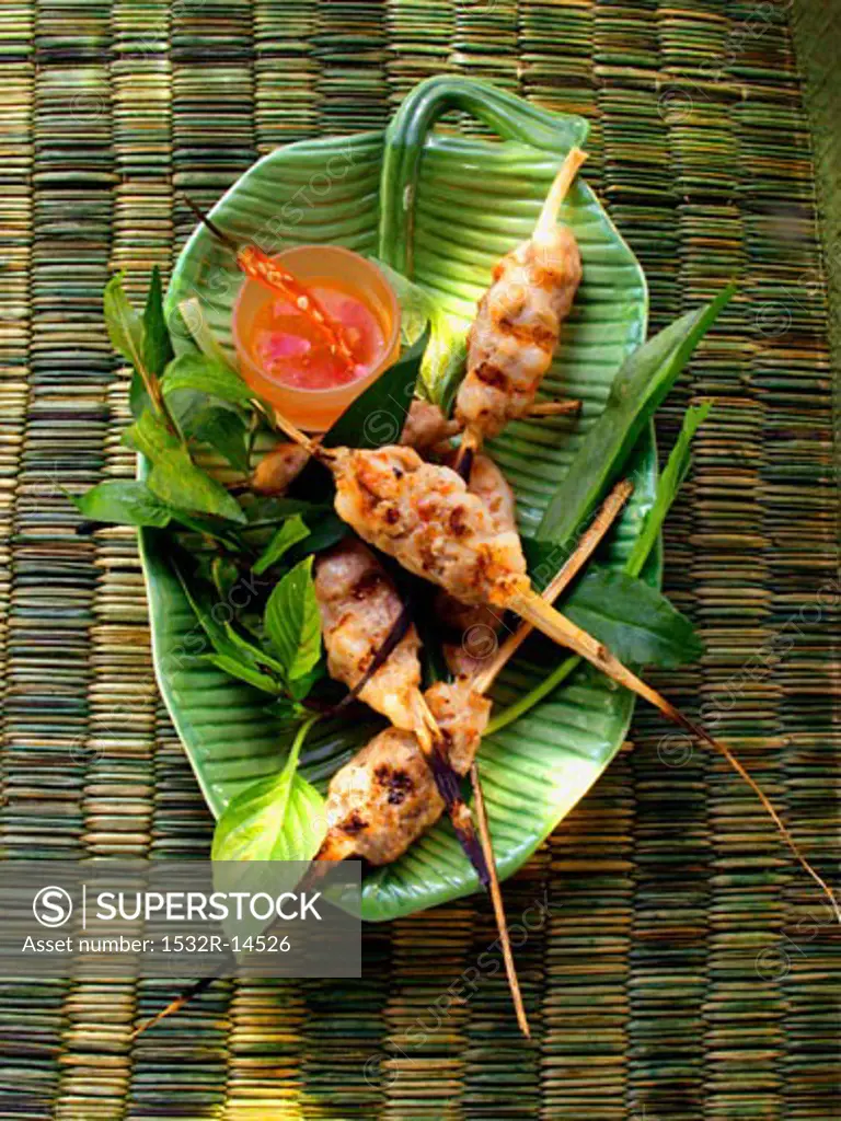 Pork and shrimp kebabs with sauce