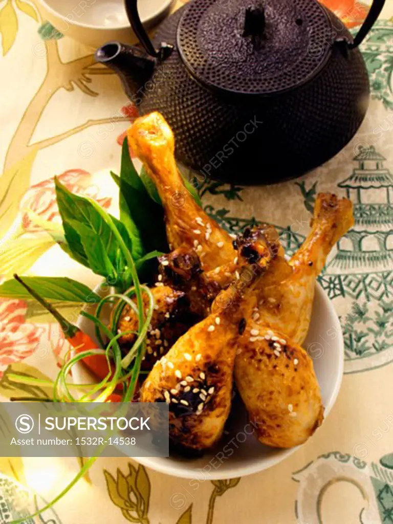 Asian chicken legs with sesame, teapot