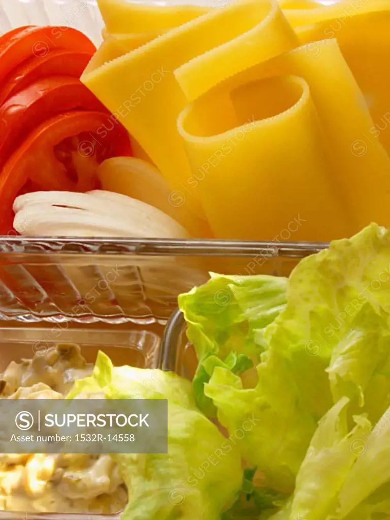 Sandwich ingredients: cheese, tomatoes, lettuce