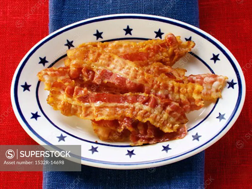 Fried bacon on American plate