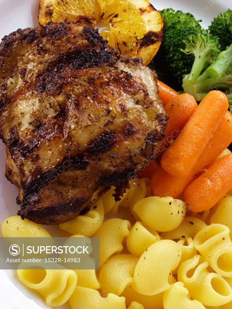 Barbecued chicken breast with noodles and vegetables
