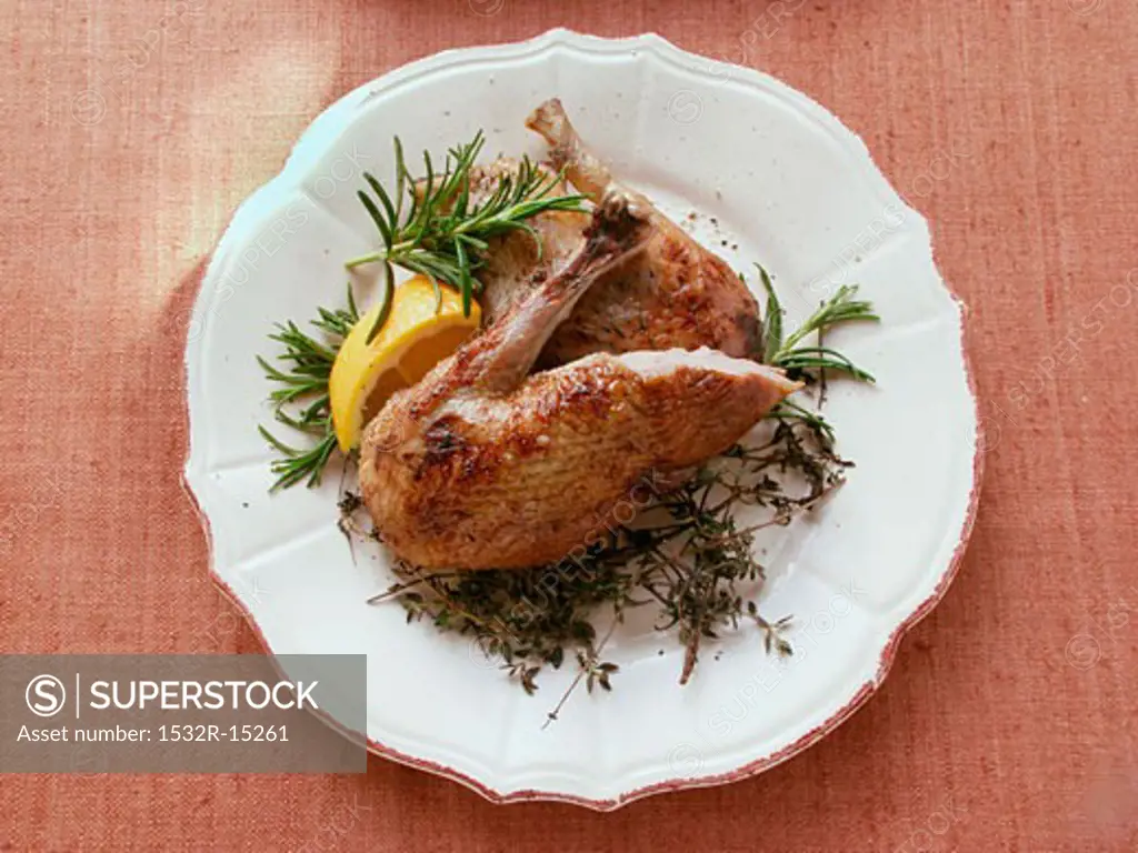 Roast legs of wild duck with herbs and lemon