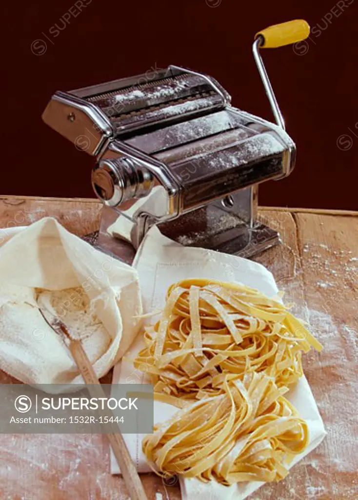 Home-made tagliatelle, flour and pasta maker