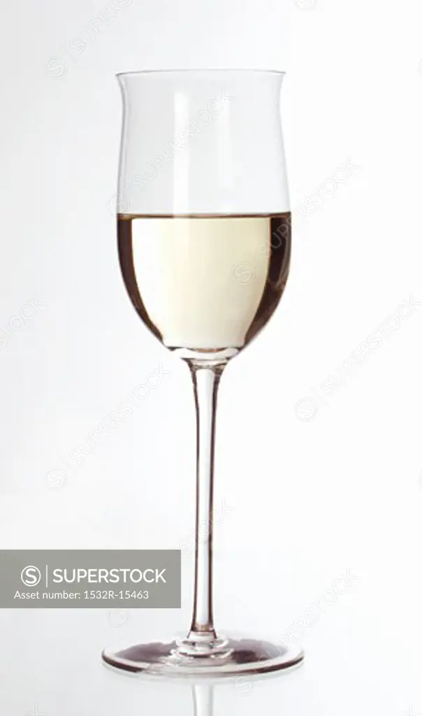 White wine glass, half filled