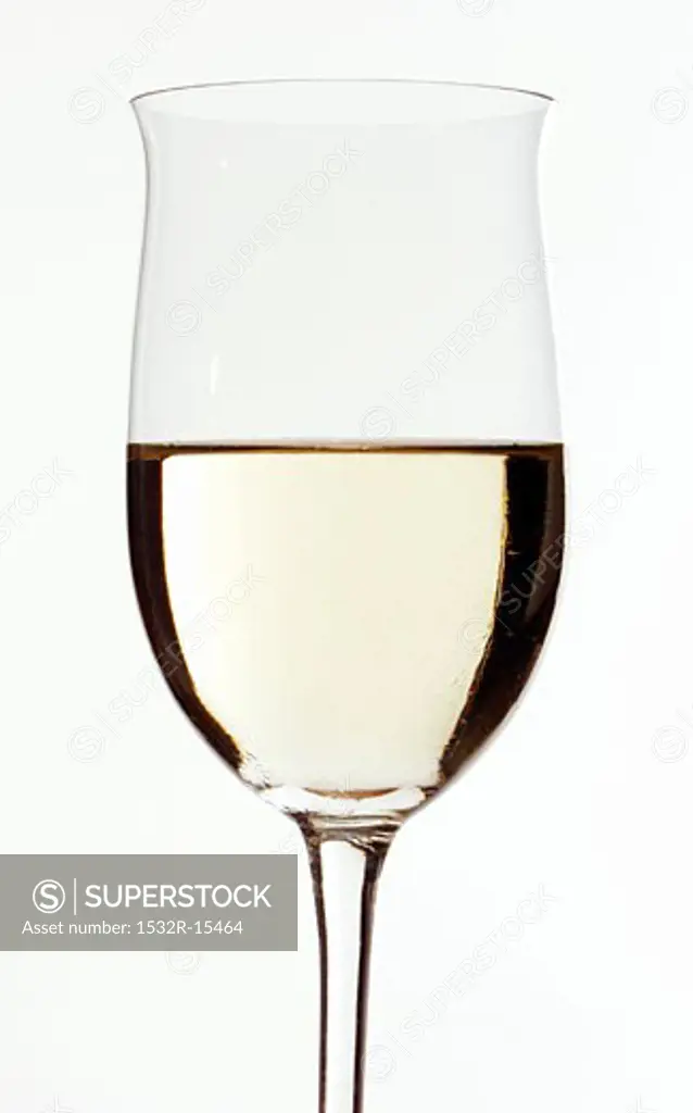 White wine glass, half filled