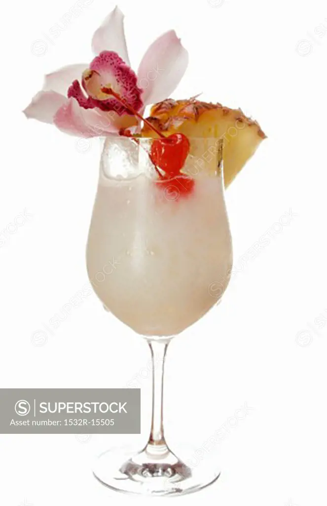 Caribbean drink with coconut milk and pineapple in glass