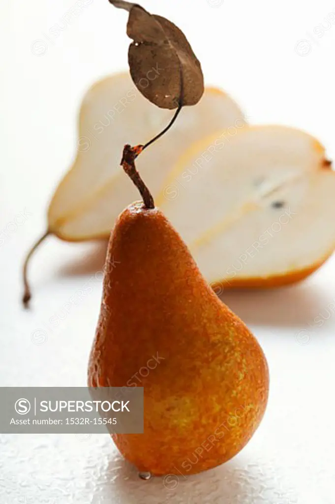 Fresh pears, one halved