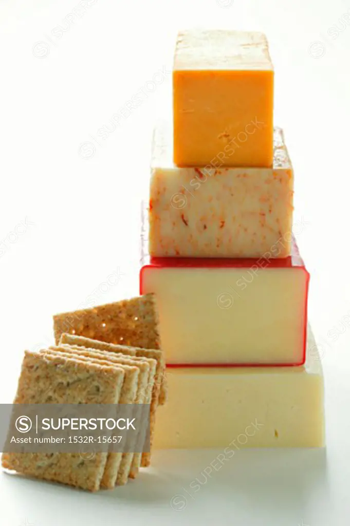 Various types of cheese, in a pile, cracker