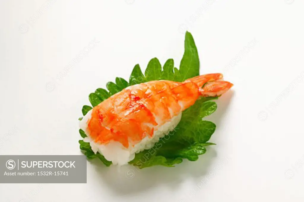 Nigiri sushi with shrimp on shiso leaf