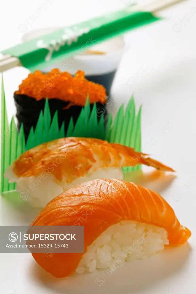 Sushi with salmon, shrimp and caviare, soy sauce