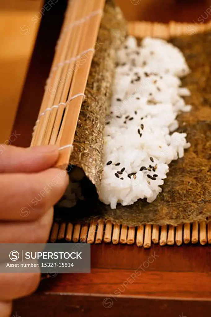 Preparing rolled sushi