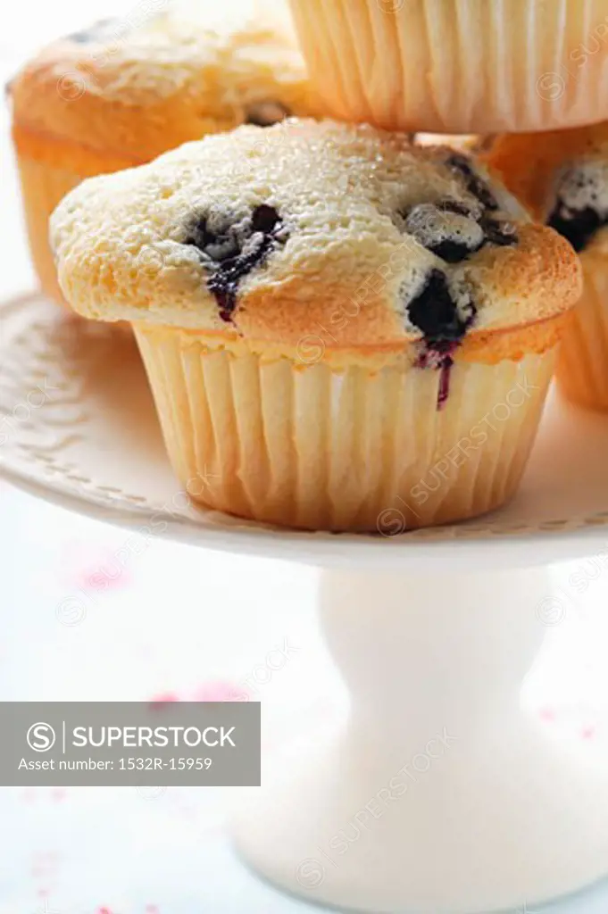 Blueberry muffins on cake plate